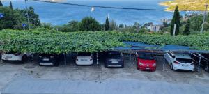 a bunch of cars parked in a parking lot at Villa Narona in Mlini