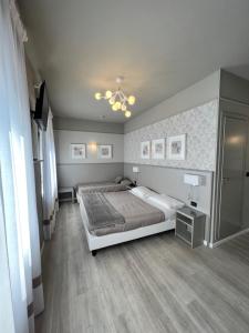 Postel nebo postele na pokoji v ubytování Hotel La Pace