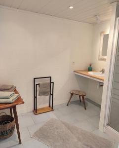 a bathroom with a mirror and a sink at Maison Caiada in Urrugne