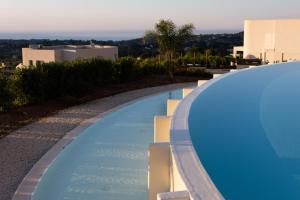 a swimming pool on the side of a building at Villa Cristina - Relax - Piscina e Vista Mare in Castellammare del Golfo