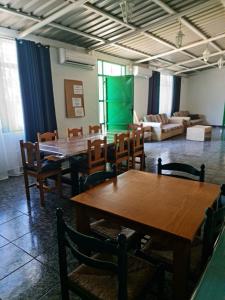 a room with tables and chairs and a couch at Aguatona in Ingenio
