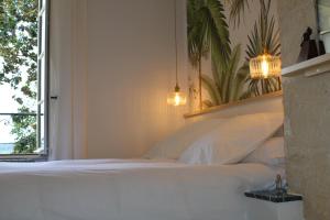 Malis Castera Le Petit Château客房内的一张或多张床位