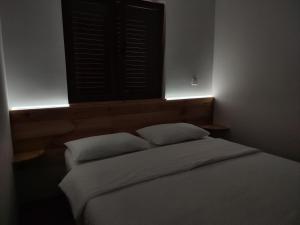 Letto o letti in una camera di Monte Pino Lux Apartments