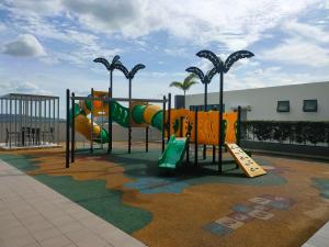 a playground with a slide and a slide at Nur Mateen's Studio - Vista Bangi Service Apartment in Kajang