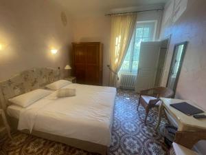Postel nebo postele na pokoji v ubytování Hotel Villa Provencale