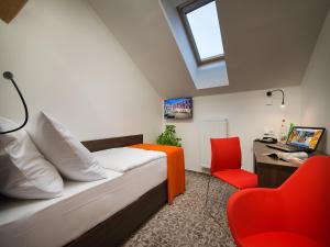 Televízia a/alebo spoločenská miestnosť v ubytovaní EA Business Hotel Jihlava