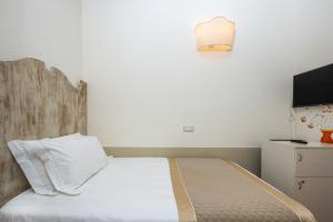 Ένα ή περισσότερα κρεβάτια σε δωμάτιο στο Albergo Le Terme