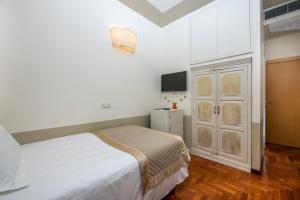 Ένα ή περισσότερα κρεβάτια σε δωμάτιο στο Albergo Le Terme