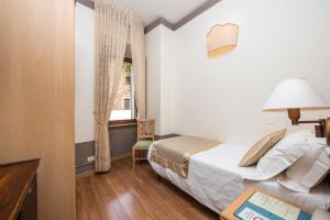 Ένα ή περισσότερα κρεβάτια σε δωμάτιο στο Albergo Le Terme