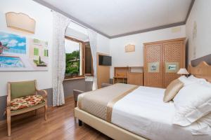 Ένα ή περισσότερα κρεβάτια σε δωμάτιο στο Albergo Le Terme