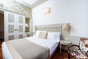Ένα ή περισσότερα κρεβάτια σε δωμάτιο στο Albergo Le Terme