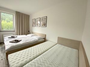 Postel nebo postele na pokoji v ubytování Apartmán LUEL