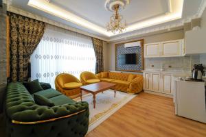 a living room with a couch and a table at Pearl of Cappadocia in Avanos