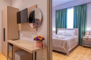 A bed or beds in a room at Casa Maria Hotel