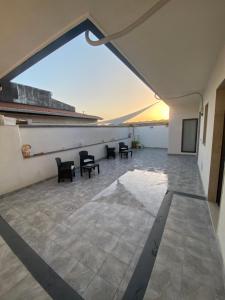a view from the roof of a building with chairs at AEROPORTO KATANÈ ROOMS in Catania