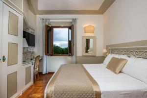 Ένα ή περισσότερα κρεβάτια σε δωμάτιο στο Albergo Le Terme