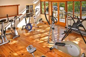 a gym with several exercise bikes in a room at Beautiful Château with Private Pool near Cahors in Cambayrac
