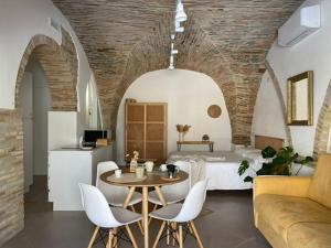 a bedroom with a bed and a table and chairs at Residenze Aimone in Vasto