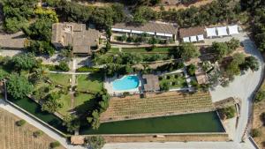 an aerial view of a mansion with a pool and yard at Rondaia in Esporles