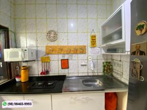 Η κουζίνα ή μικρή κουζίνα στο Guarnicê Hostel