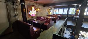 an overhead view of a restaurant with brown leather seats at Central Guesthouse Bread & Breakfast in Chiang Rai