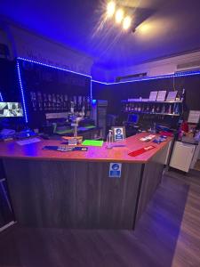 a bar with a counter in a room with at Hayward Hotel in Blackpool