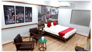 Annandam Inn(Hotel Anand)客房内的一张或多张床位
