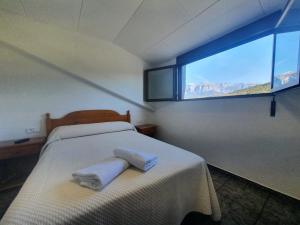 Ένα ή περισσότερα κρεβάτια σε δωμάτιο στο Hostal Apolo XI