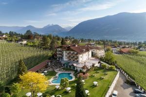 an aerial view of a hotel in a vineyard at Hotel Burggräflerhof in Merano