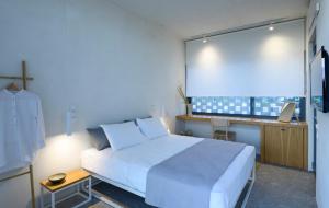 Ένα ή περισσότερα κρεβάτια σε δωμάτιο στο Bouca Houses