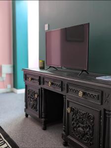 A television and/or entertainment centre at 205a Monton Road