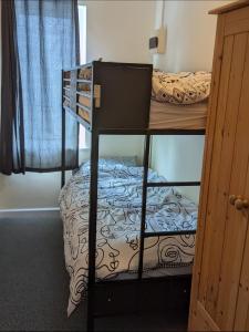 a room with two bunk beds in a room at 205a Monton Road in Manchester