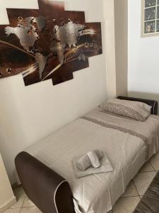 Un pat sau paturi într-o cameră la L'anima del viaggio a Torino