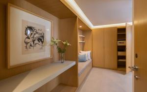 a room with a vase of flowers sitting on a shelf at Royal Azur Thalassa in Hammamet