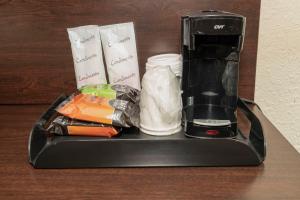 a black blender sitting on top of a table at Red Roof Inn & Suites Monee in Monee