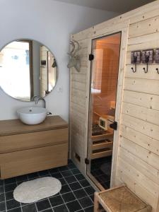 a bathroom with a sink and a mirror at Chambre d'Hôte Touquet's Garden in Cucq