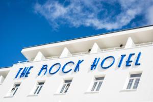 a large white building with a sign on it at Rock Hotel in Gibraltar
