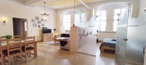 a living room with a kitchen and a dining room at Apartment Madrid in Mühlhausen