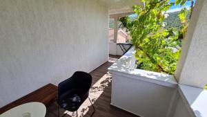 Vonkajšia záhrada v ubytovaní Apartmani Mlinar - studio apartment