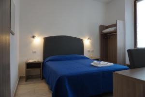 Postel nebo postele na pokoji v ubytování Holiday Rooms