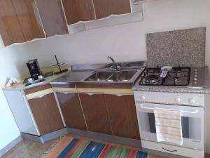 Cucina o angolo cottura di Casa dello Scoglio nel mare