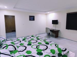 A bed or beds in a room at Abuja Modern Apartments
