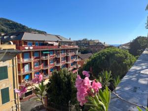 a view from the balcony of a building with pink flowers at Cavour in Levanto