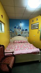 Postel nebo postele na pokoji v ubytování Donggang Town B&B