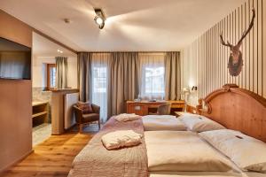 Voodi või voodid majutusasutuse Hotel Marmolada toas