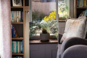 een boekenplank met een plant en een raam met boeken bij Number Four - Piran View in Padstow
