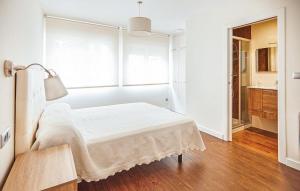 A bed or beds in a room at A Misericordia Viveiro
