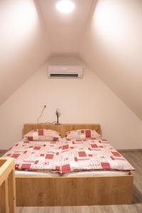 a bedroom with a bed in the attic at Farmhouse Soklic in Bohinj
