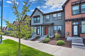 a house with a red door at Spacious Denver Townhome Near Central Park! in Denver