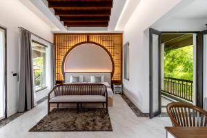 a bedroom with a bed and a balcony at Sclass 2 Luxe Pools Villa & Breakfast , city area in Chiang Mai